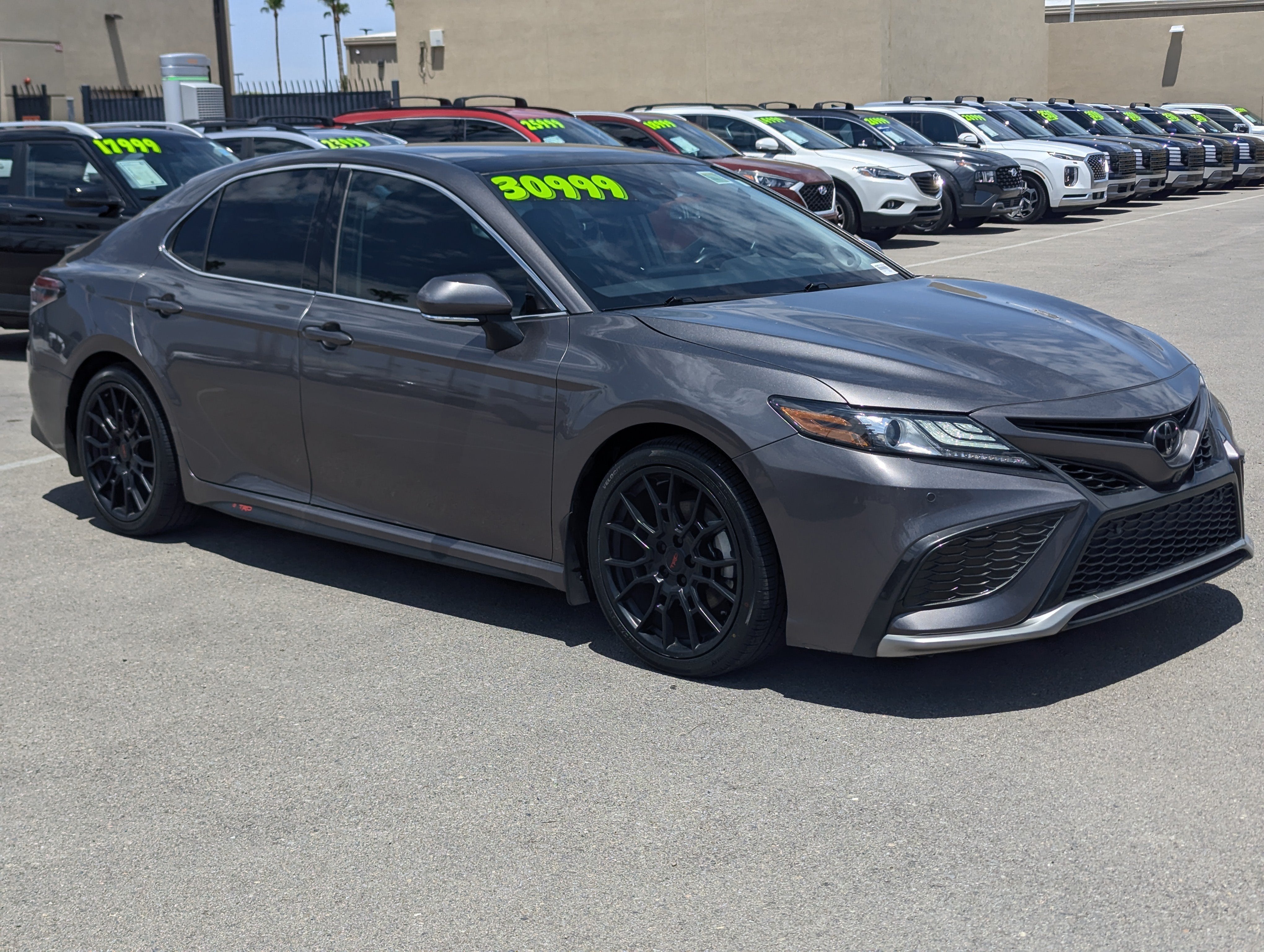 2021 Toyota Camry XSE V6 in Predawn Gray Mica — front three-quarter view